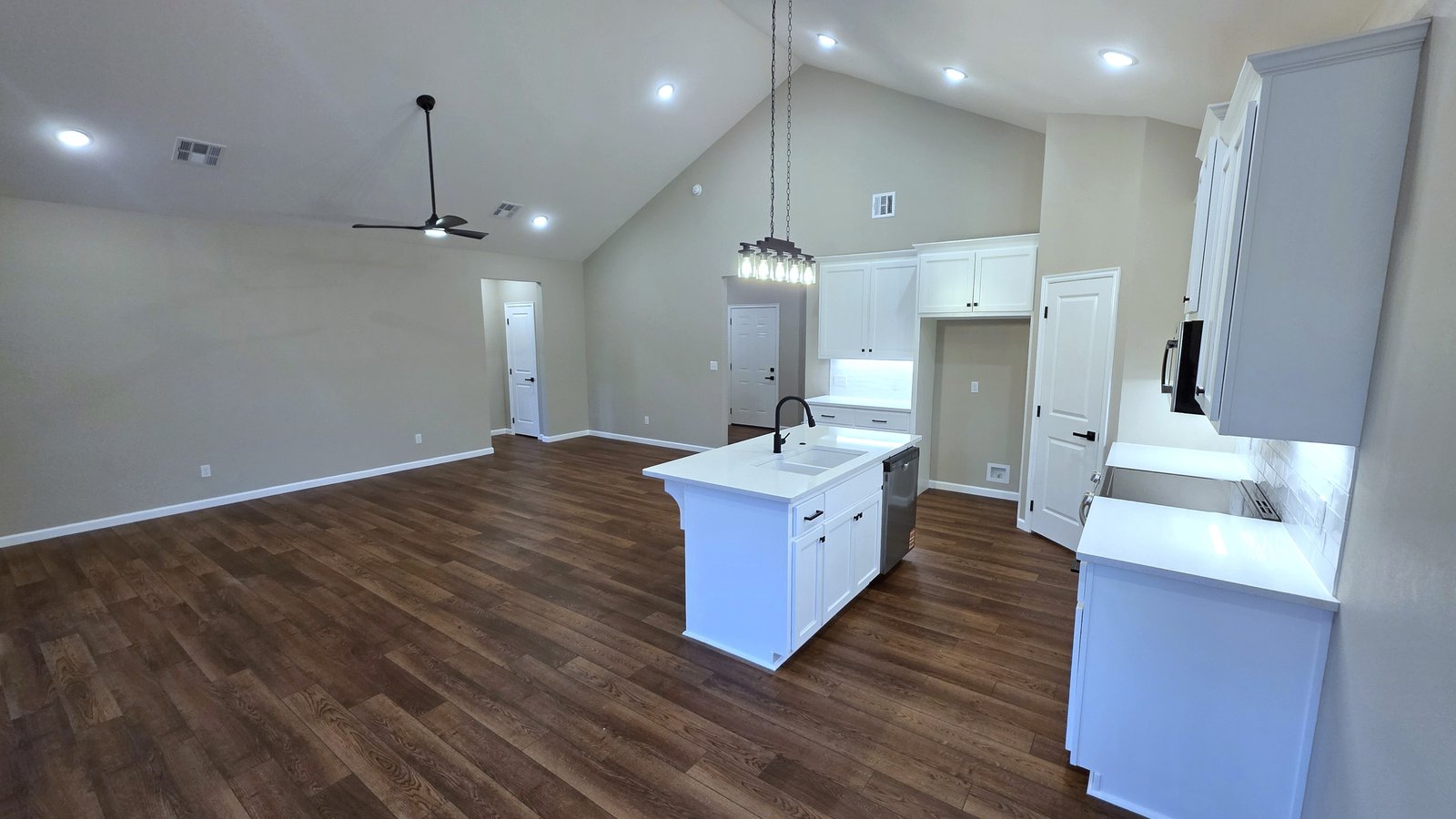 Custom kitchen with white island and hardwood floors
