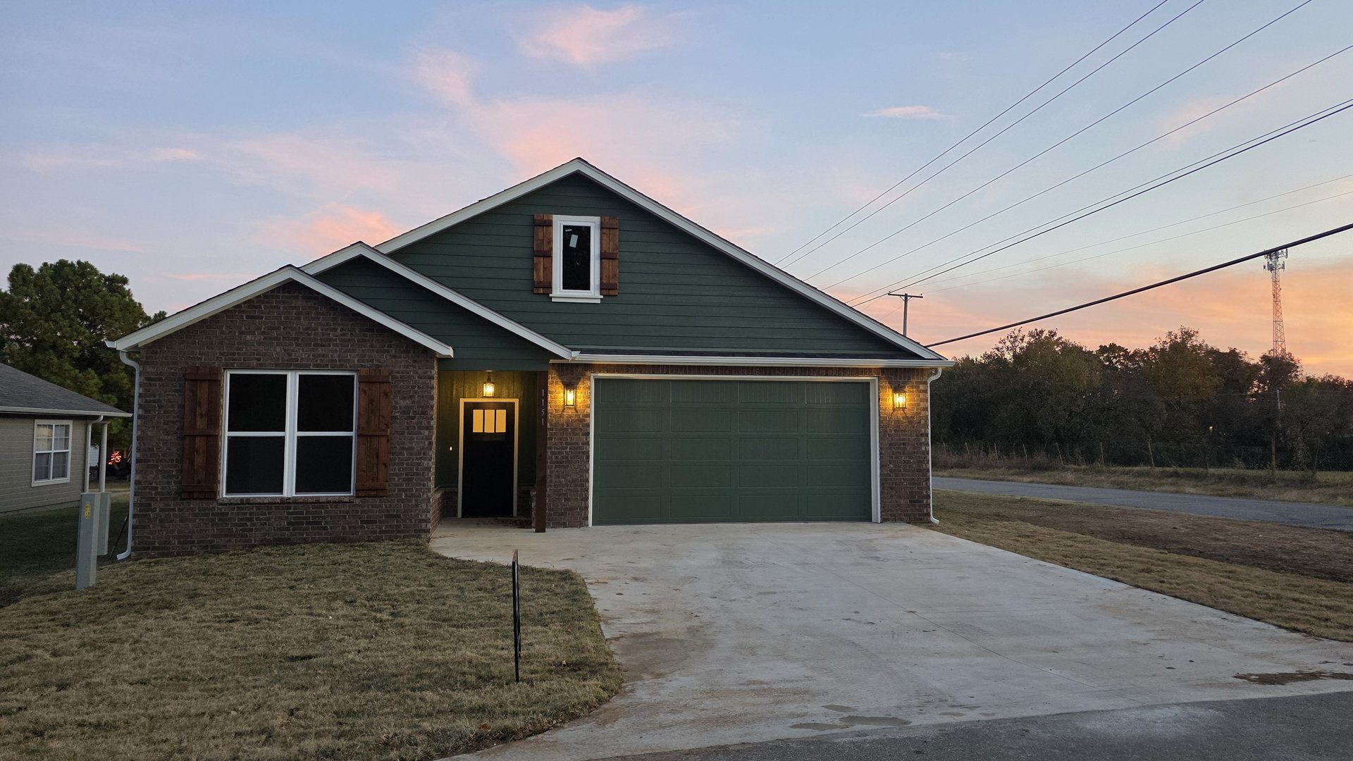 Custom home exterior at twilight in northeast Oklahoma