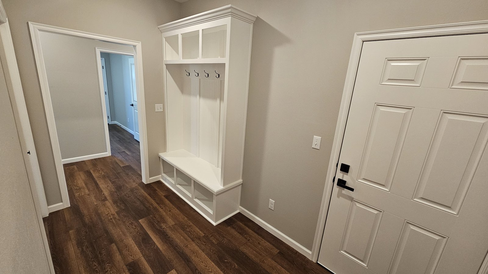 Mudroom entry with built-in lockers and storage